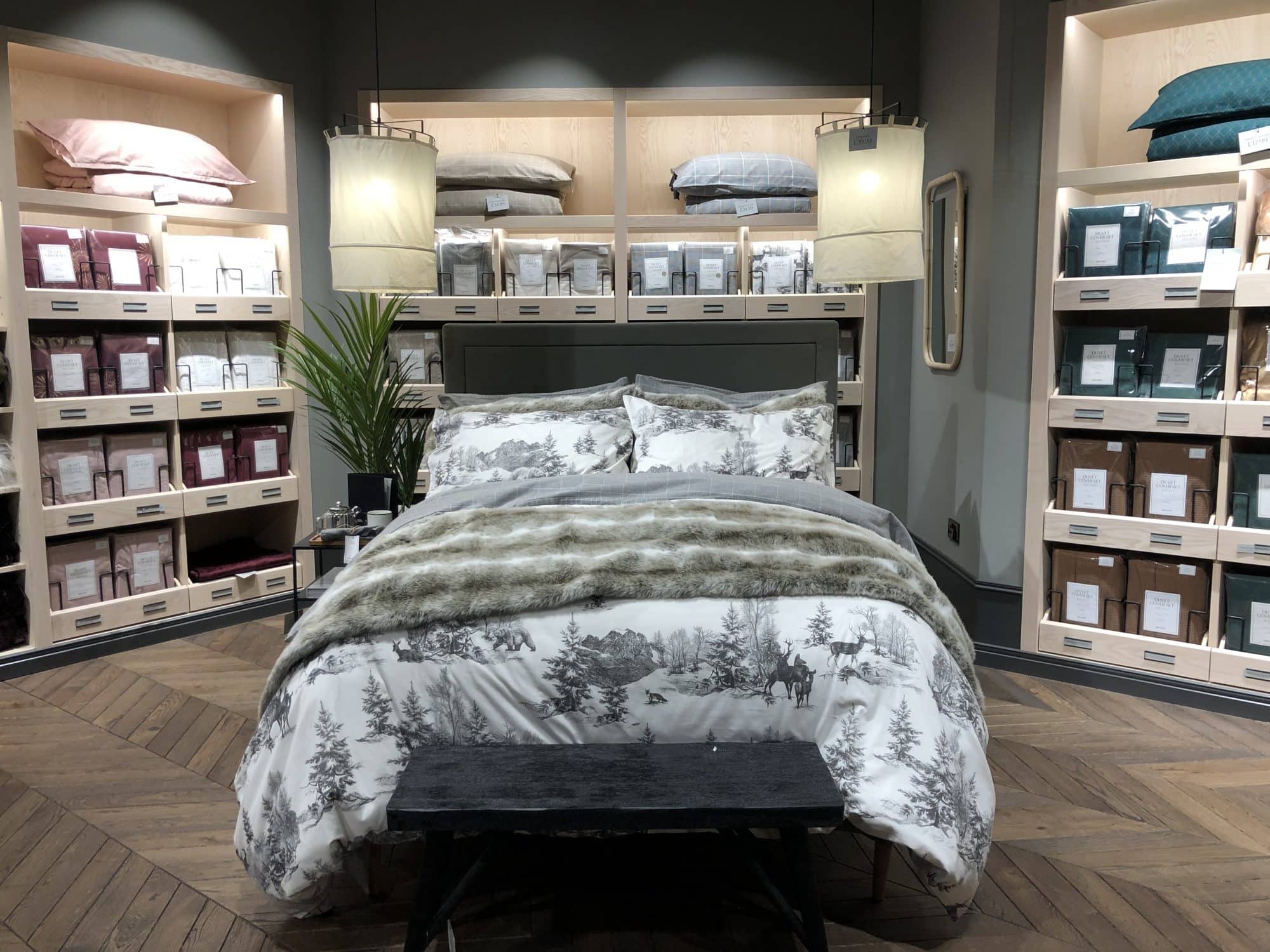 Bed in store with branding all around