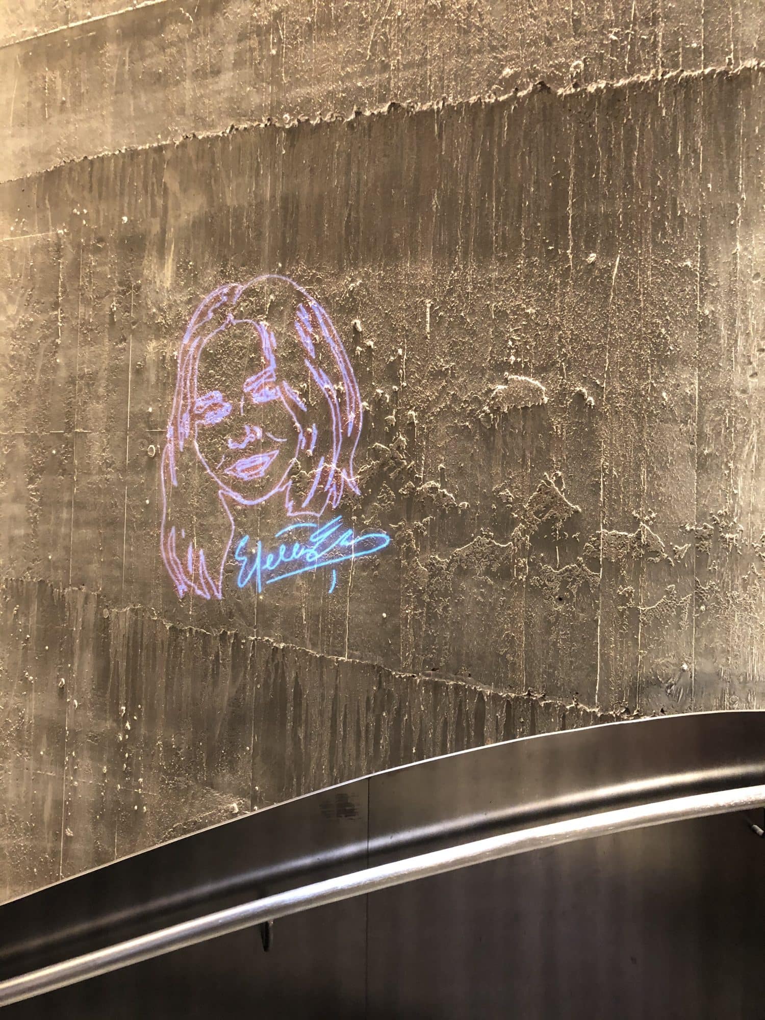 Stella mccartney's face painted on a wall